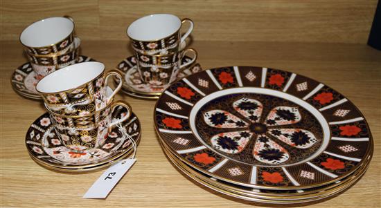 Four Royal Crown Derby plates and six cups and saucers